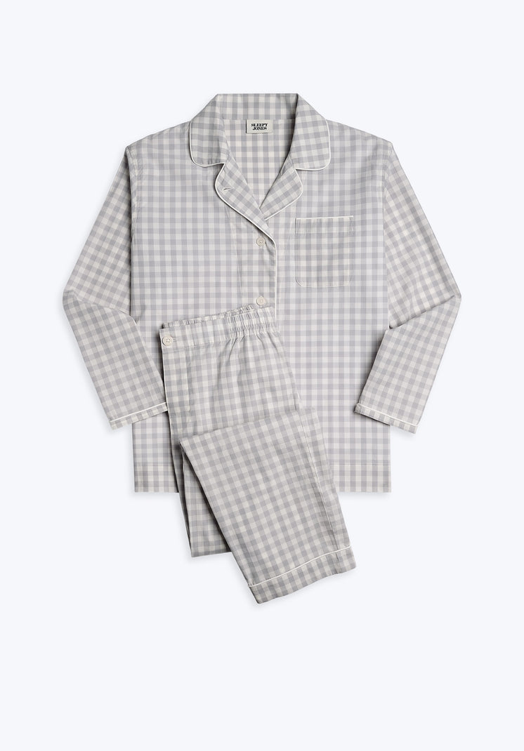 A grey and white gingham pajama set with long sleeves and button-fly pants.