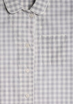 a close up photo of the collar detail, buttons, and chest pocket of a grey and white gingham pajama top